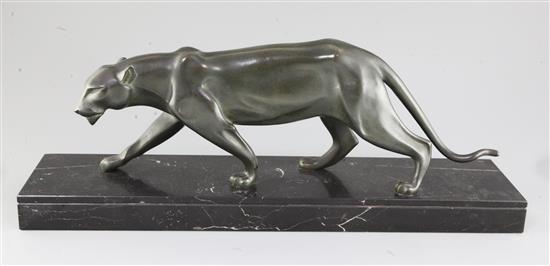 Henri Molins. An Art Deco green patinated bronze model of a prowling panther, width 22.5in. height 8.5in.